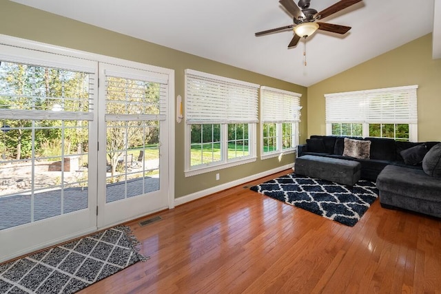 sunroom / solarium featuring ceiling fan and vaulted ceiling