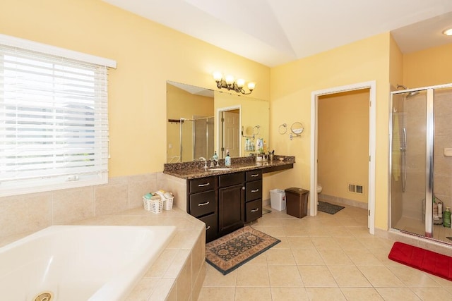 full bathroom with tile patterned floors, plus walk in shower, vanity, and toilet