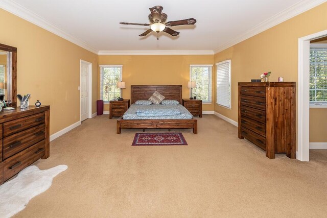 bedroom featuring ceiling fan, light carpet, and multiple windows