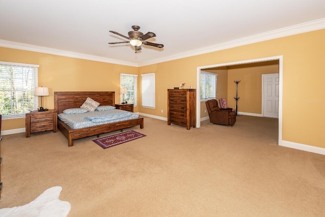 carpeted bedroom featuring multiple windows, ceiling fan, and crown molding