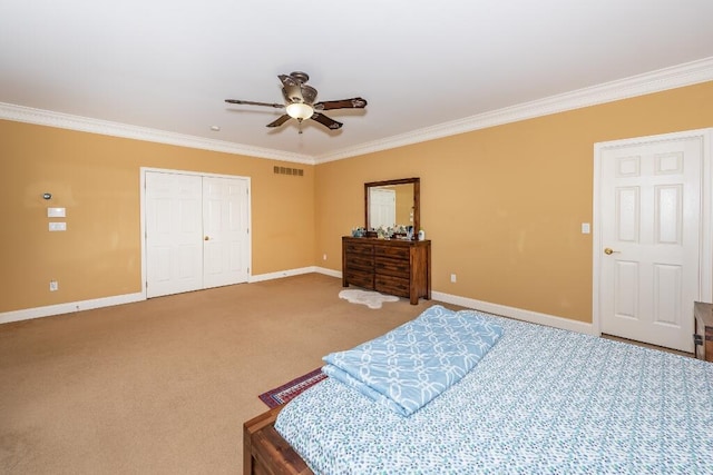 carpeted bedroom featuring a closet, ceiling fan, and crown molding