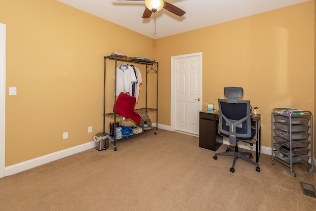 unfurnished office with carpet and ceiling fan