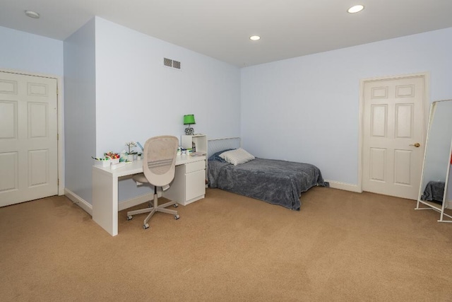 bedroom with light carpet