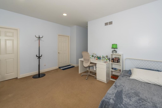 bedroom with light colored carpet