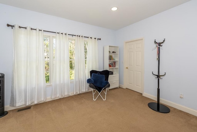 unfurnished room with light colored carpet