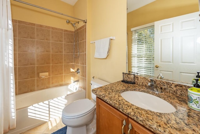 full bathroom featuring tile patterned floors, shower / bath combination with curtain, toilet, and vanity