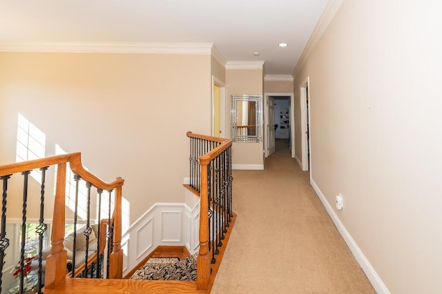 corridor with light colored carpet and ornamental molding