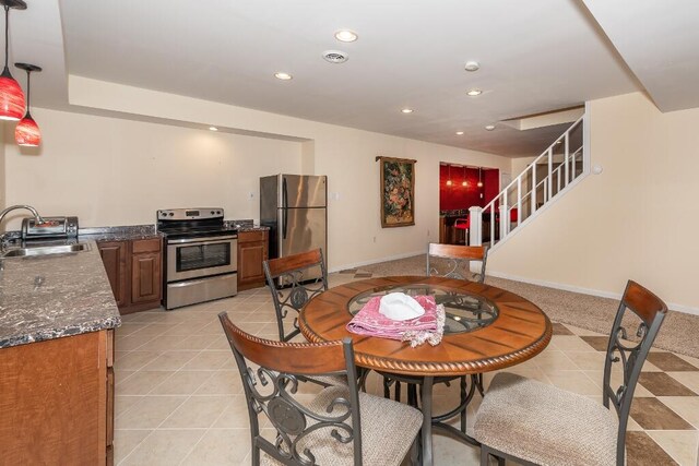 tiled dining space with sink