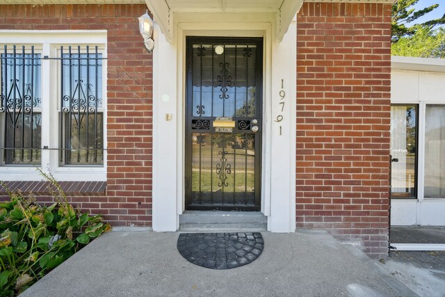 19789-19791 Meyers Rd, Detroit, MI 48235 - doorway to property featuring brick siding