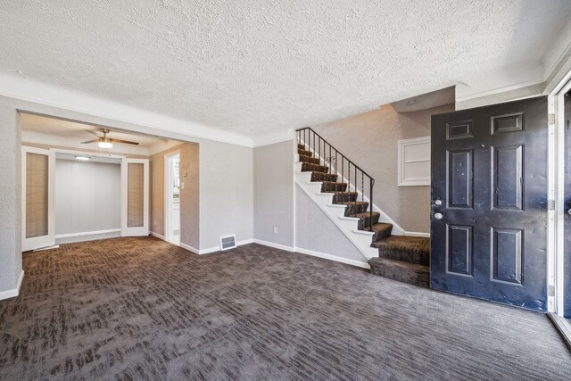 19789-19791 Meyers Rd, Detroit, MI 48235 - carpeted foyer featuring a textured ceiling, stairway, baseboards, and a ceiling fan