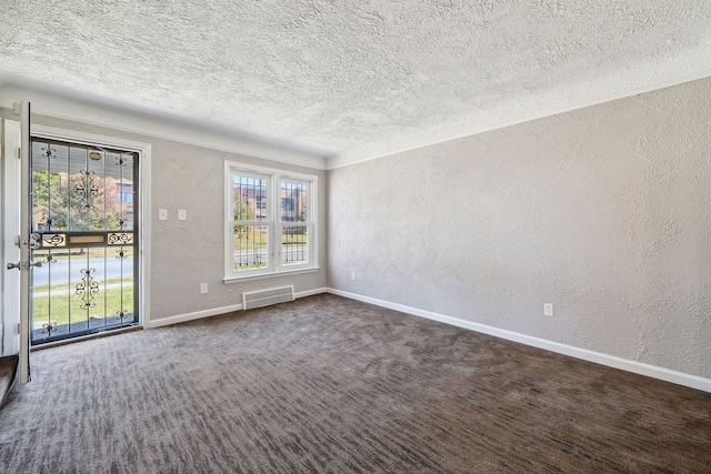 19789-19791 Meyers Rd, Detroit, MI 48235 - empty room with a textured wall, a textured ceiling, baseboards, and dark carpet