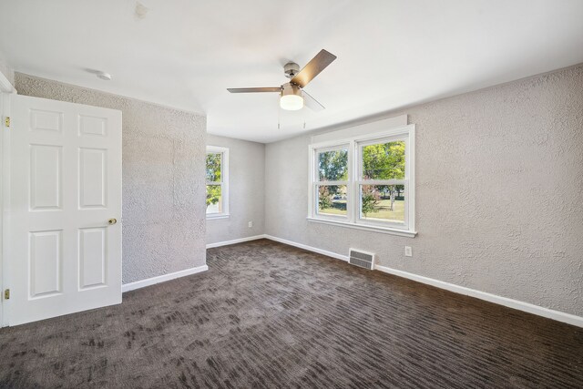 19789-19791 Meyers Rd, Detroit, MI 48235 - carpeted spare room featuring a textured wall, ceiling fan, baseboards, and a smoke detector