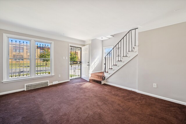 19789-19791 Meyers Rd, Detroit, MI 48235 - foyer entrance with stairs, baseboards, and dark carpet