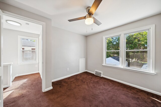 19789-19791 Meyers Rd, Detroit, MI 48235 - unfurnished room with dark carpet, healthy amount of natural light, and ceiling fan