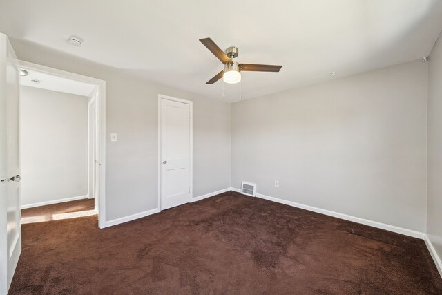 19789-19791 Meyers Rd, Detroit, MI 48235 - unfurnished bedroom with dark colored carpet, baseboards, and a ceiling fan