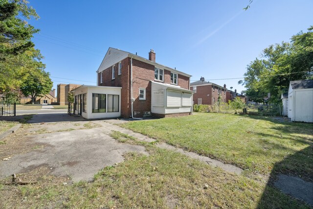 19789-19791 Meyers Rd, Detroit, MI 48235 - rear view of property with brick siding and a chimney