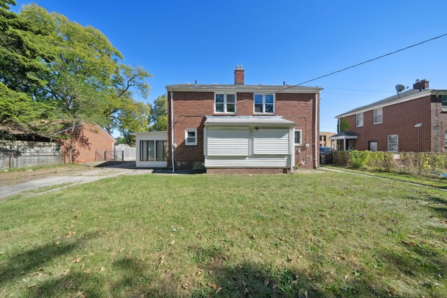19789-19791 Meyers Rd, Detroit, MI 48235 - back of house featuring brick siding and a chimney