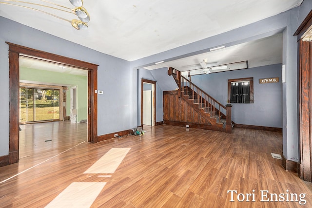 unfurnished living room featuring wood-type flooring