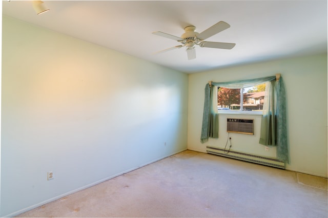 empty room featuring ceiling fan, cooling unit, light colored carpet, and a baseboard heating unit