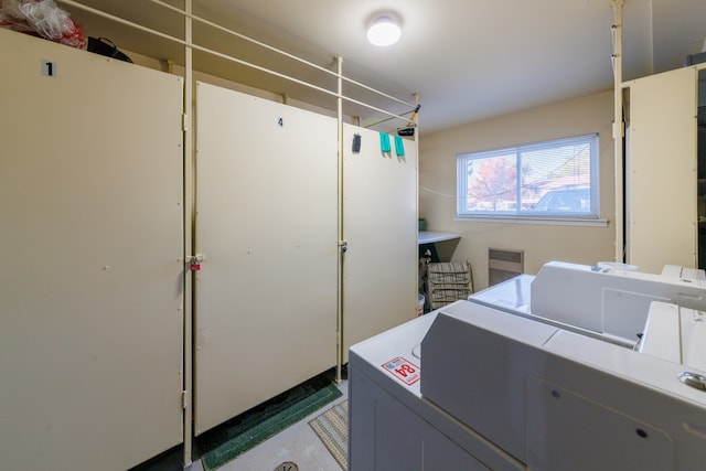 washroom with independent washer and dryer