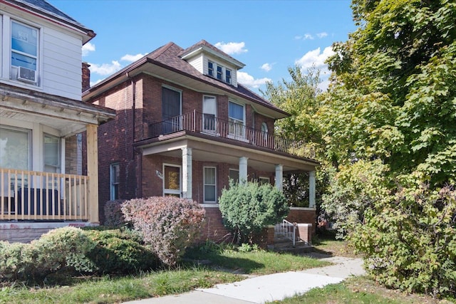 view of front of house with a balcony