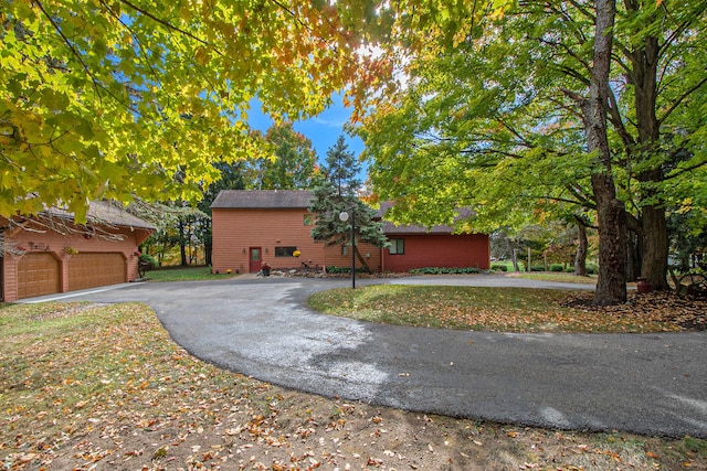 view of side of property with a garage