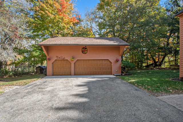 garage with a lawn