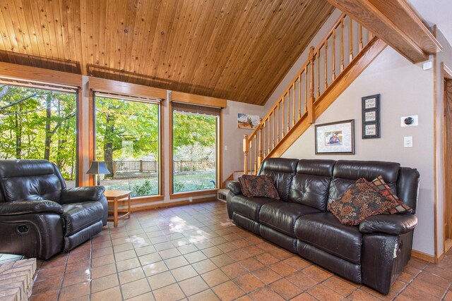 living room featuring tile patterned flooring, vaulted ceiling, plenty of natural light, and wood ceiling