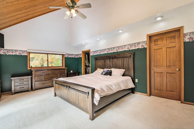 bedroom featuring ceiling fan, light colored carpet, and high vaulted ceiling