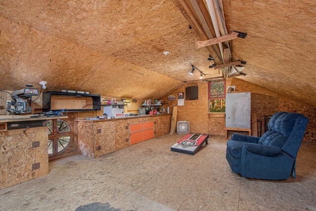 interior space featuring vaulted ceiling and a wealth of natural light