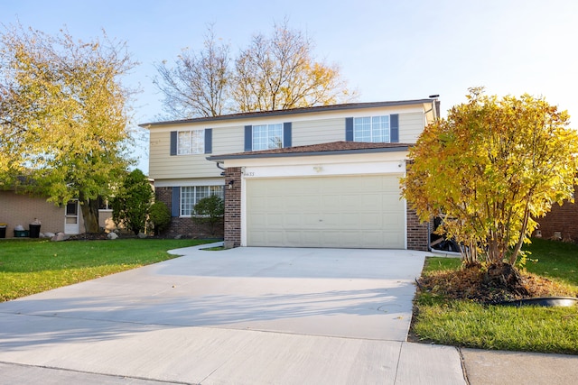 view of front property featuring a garage and a front yard