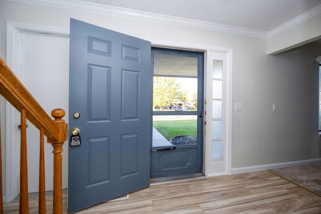 entryway featuring light hardwood / wood-style floors and ornamental molding