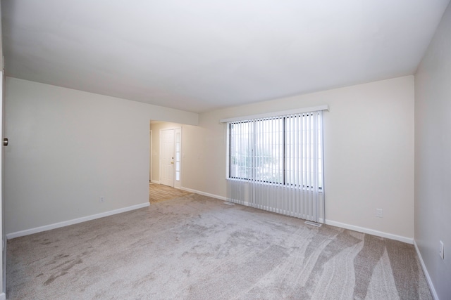 empty room with light colored carpet