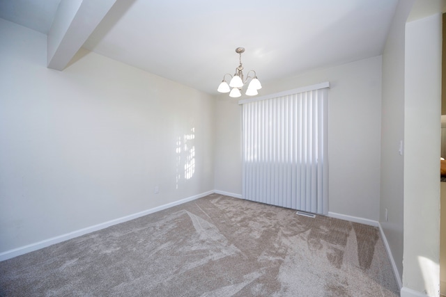 carpeted spare room featuring beamed ceiling and a notable chandelier