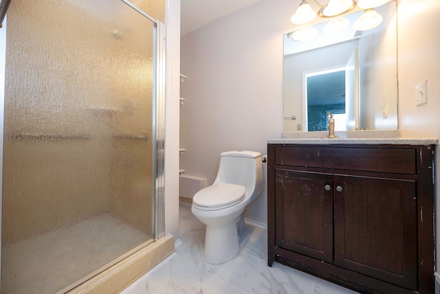 bathroom featuring vanity, an enclosed shower, and toilet