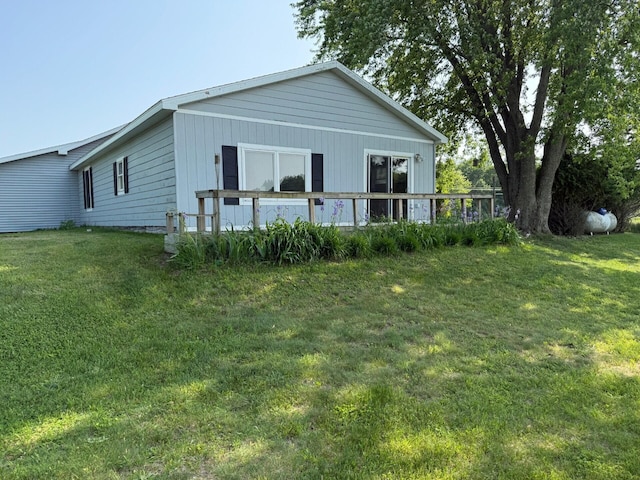 2702 E Hoague Rd, Michigan, MI 49411 - rear view of house with a yard