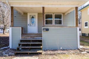 entrance to property with covered porch