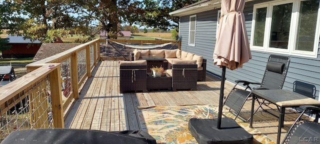 wooden terrace with outdoor lounge area