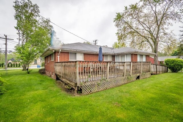 25672 Avondale St, Dearborn Heights, MI 48125 - rear view of property with a yard, a deck, and brick siding