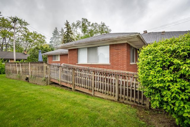 25672 Avondale St, Dearborn Heights, MI 48125 - rear view of property with brick siding and a yard