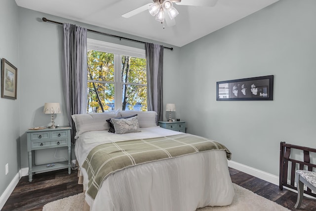 bedroom featuring ceiling fan and dark wood-type flooring