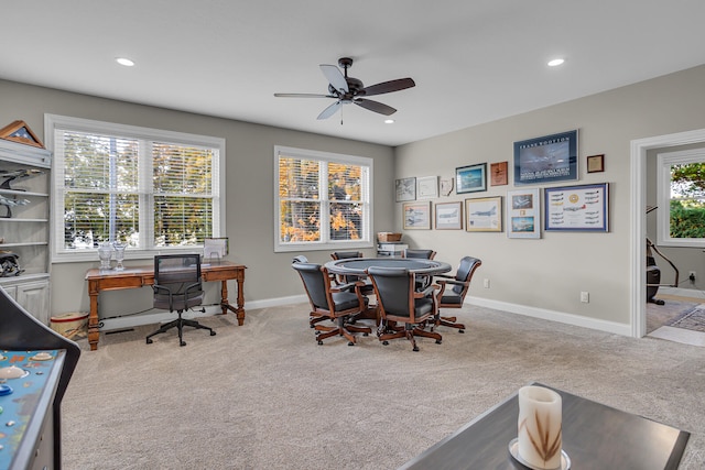 carpeted dining area featuring ceiling fan