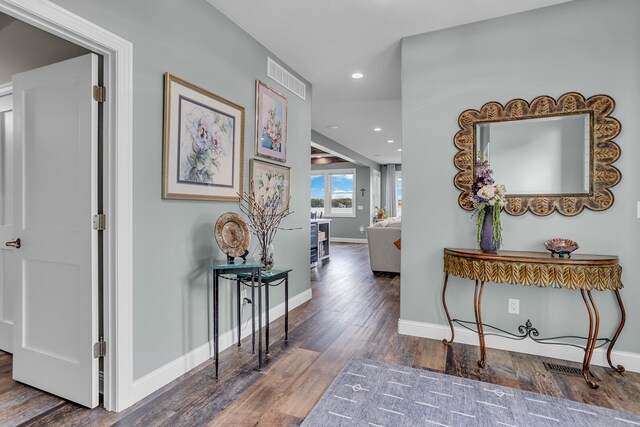 corridor with dark hardwood / wood-style floors