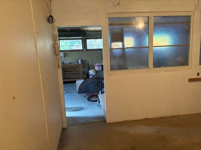 hallway with concrete flooring