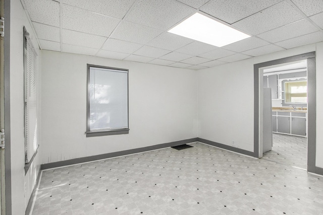 311 Bessie St, Kalamazoo, MI 49007 - spare room with a paneled ceiling, baseboards, and light flooring
