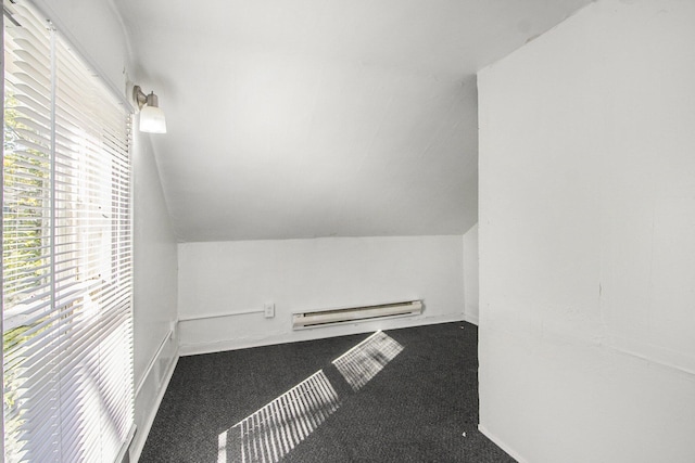 311 Bessie St, Kalamazoo, MI 49007 - additional living space with a baseboard heating unit, carpet flooring, vaulted ceiling, and baseboards