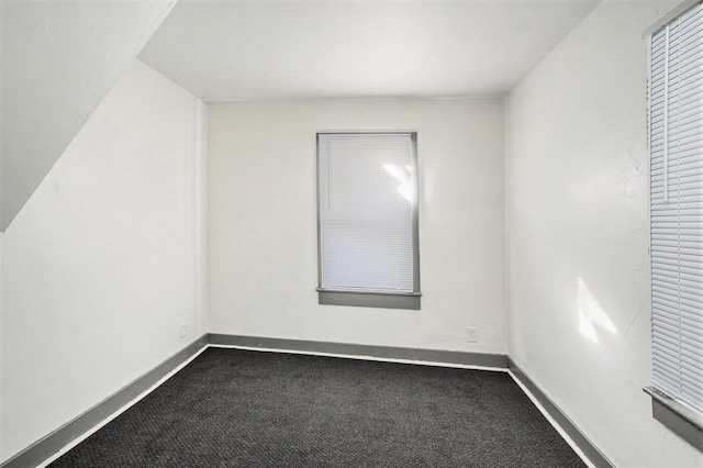 311 Bessie St, Kalamazoo, MI 49007 - unfurnished room with dark colored carpet and baseboards
