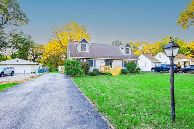 cape cod home featuring a front lawn