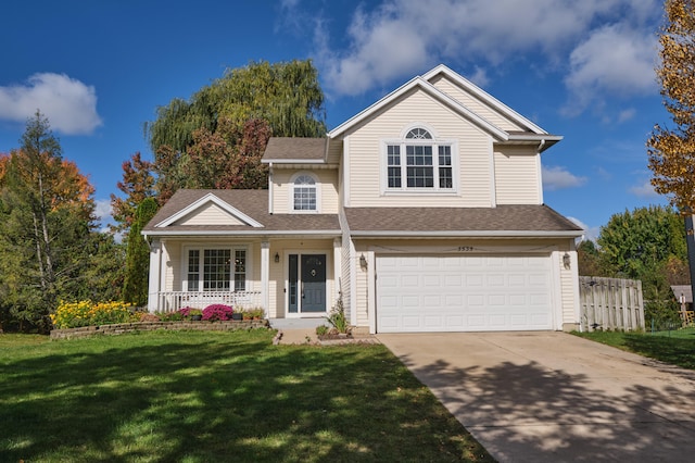 view of front of property featuring covered porch, a front yard, and a garage