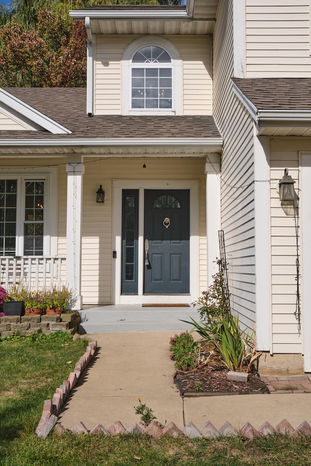 view of exterior entry featuring a porch